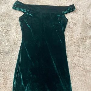 Emerald green velvet off-the-shoulder dress.